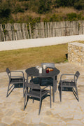 Set de table ronde Ø110 cm en aluminium Elton et 4 chaises de jardin empilables en polypropylène Graneli